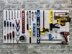 there are many tools hanging on the wall