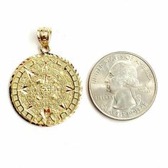 (100% AUTHENTIC) 14k yellow gold Aztec Mayan sun calendar pendant charm. "Comes with a gift box" 14K yellow Solid Gold pendant charm. Solid 14K gold, not plated. Nicely polished and shiny. Stamped 14K for Authenticity. ADDITIONAL INFO: REAL 14K Yellow Gold. Polished, Shiny  5 grams. 1 inch diameter Please refer to the photo of the item next to a quarter for comparison purposes. Please ask me any questions you may have before you make a purchase.Shipping: Your order will be professionally packed Symbolic Jewelry With Sun Design Round Pendant, Symbolic Round Pendant Jewelry With Sun Design, Symbolic Sun Design Round Pendant Jewelry, Symbolic Gold Jewelry With Sun Design, Gold Jewelry With Sun Design, Gold Amulet Jewelry With Sun And Moon Design, Gold Sun And Moon Amulet Jewelry, Gold Jewelry With Sun Design In 14k Gold, Sun Calendar