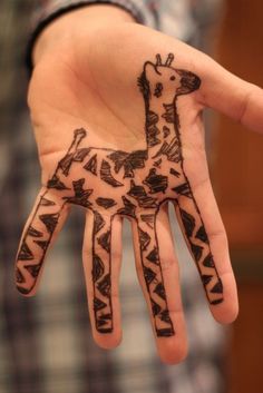 a hand with a giraffe drawn on it