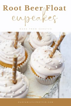 some cupcakes with white frosting and sprinkles on top are shown