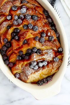 blueberry french toast in a white casserole dish