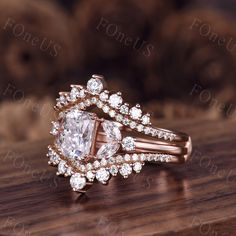 a close up of a diamond ring on a wooden table