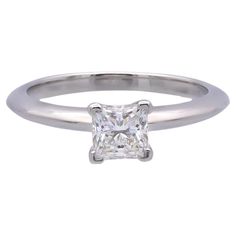 a princess cut diamond engagement ring in white gold with a single clawed shant