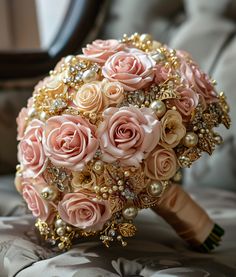 a bridal bouquet with pink roses and pearls