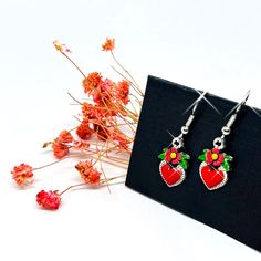 These beautiful Frida Heart Flowered Dainty Earrings embody Mexican folk art with dainty, hand-painted enamel designs. The perfect way to express your love for Mexican art and culture. Be inspired by Frida Kahlo's unique style and enjoy wearing these gorgeous earrings. Looking for an original, cute and affordable gift for you or that special person out there? These marvelous hand painted and handcrafted Frida's heart earrings are exactly what you are looking for! Crafted with care and exquisite Affordable Gifts, Mexican Art, Mexican Folk Art, Art And Culture, Dainty Earrings, Flower Heart, Gorgeous Earrings, Special Person, Heart Earrings