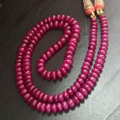 "Natural Ruby Necklace , 257.74 cttw , Ruby Mala , Ruby Beads Necklace , Ruby Necklace ,Ruby , African Ruby , Ruby Gemstone , Tanzanian Ruby Total Carat Weight : 257.74 Cts. Shape : Plain Round Flat Beads ( Drilled ) Strands : 1 Total Necklace Size : 21 Inches ( Adjustable ) Bead Size ( in mm ) : 5.5 - 7.5 x 3.5 - 5.0 Approx. ( Descending Size: biggest size in centre , smallest on ends ) Origin : Africa ( Tanzania ) A hand made \" Dori Type \" Closure Called \" Sarafa \" Made of silk threads , M Temple Jewelry With Polished Round Beads, Beaded Temple Jewelry Round Necklace, Beaded Round Temple Jewelry Necklaces, Temple Jewelry Necklaces With Polished Beads, Round Beaded Temple Jewelry, Temple Jewelry Necklace Hand-strung For Gift, Temple Jewelry Style Hand-strung Necklace For Gift, Bridal Beaded Necklace With Round Beads, Temple Jewelry Style, Hand-strung Temple Jewelry Necklaces For Gifts