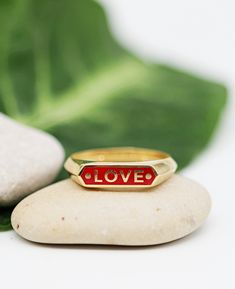 "A personalized signet ring, made of solid 14k yellow gold and colorful enamel inlay. A customized name ring for women and men, available in black, red, green, purple, white and blue enamel. Solid 14k yellow gold name ring, a customized narrow bar signet ring, made just for you. Personalize the ring with any name or word you choose. It can be your name, a name of a loved one, a child's name, or any word that carries a special meaning or inspiration. The narrow top bar is inlaid with enamel in th Gift 14k Gold Black Enamel Ring, 14k Gold Black Enamel Ring Gift, Yellow Gold Enamel Ring With Black Enamel As Gift, Gift Black Enamel 14k Gold Ring, Personalized Enamel Ring For Anniversary, Yellow Gold Ring With Black Enamel For Gift, Gift-appropriate Black Enamel 14k Gold Ring, Personalized Enamel Anniversary Ring, Personalized Anniversary Enamel Ring