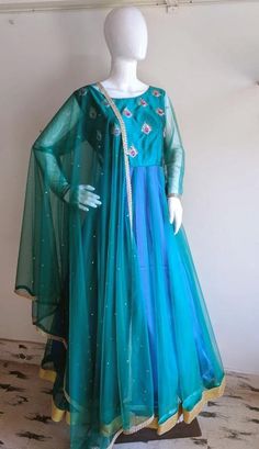 Peacock blue green anarkali with hand embroidery Green Raw Silk Anarkali Churidar, Green Anarkali Designer Gown, Green Gown With Sheer Dupatta For Designer Wear, Green Anarkali Set With Dori Work, Green Art Silk Dress With Sheer Dupatta, Designer Green Chanderi Gown, Green Chanderi Gown For Navratri, Green Raw Silk Anarkali Set With Sheer Dupatta, Green Chanderi Gown With Traditional Drape