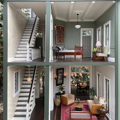 the inside of a house with stairs and furniture