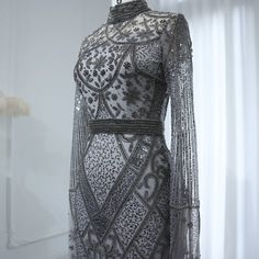 Experience elegance and sophistication with the Dreamy Vow Luxury Beaded Gray Muslim Evening Dress. Featuring intricate beading and a flattering flare silhouette, this dress is perfect for any formal occasion. The long sleeves add a touch of modesty, making it suitable for Muslim women. Elevate your style and make a statement at any wedding or party with this stunning gown. Luxury Party Dress, Wedding Dress Overskirt, Custom Flower Girl Dress, Arabic Women, Yellow Evening Dresses, Silver Evening Dress, Grey Evening Dresses, Purple Evening Dress, Champagne Evening Dress