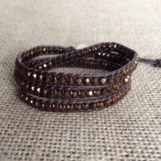 "This is a beautiful brown Bohemian beaded wrap bracelet and it would make the perfect Valentines Day gift for that special person in your life. If you're looking for a brown wrap bracelet to complete your favorite outfit you can't go wrong with this wrap bracelet. It is comfortable enough to wear all day at work and leave it on for a night out. You'll never want to take it off. This wrap bracelet is made with top quality leather cord and Czech glass beads in dark bronze. This bracelet measures Adjustable Brown Bohemian Friendship Bracelets, Adjustable Bohemian Brown Friendship Bracelets, Brown Hand Wrapped Beaded Bracelets For Festivals, Hand Wrapped Brown Beaded Bracelets For Festivals, Bohemian Brown Beaded Bracelets For Gifts, Adjustable Brown Bohemian Beaded Bracelets, Bohemian Brown Beaded Bracelets As Gift, Spiritual Brown Bracelets For Festivals, Spiritual Brown Bracelet For Festivals