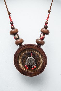 Don't worry when you lose an earring!  i lost one but made another somethingvery nice everything has a purpose and meaning in this world! Traditional Handmade Medallion Jewelry, Traditional Handmade Jewelry With Round Pendant, Traditional Handmade Round Pendant Jewelry, Unique Fair Trade Jewelry For Festivals, Traditional One-of-a-kind Round Pendant Jewelry, Red Fair Trade Jewelry As A Gift, Natural Color Dangle Jewelry For Gifts, Handmade Medallion Amulet Jewelry, Handmade Medallion Jewelry For Festival