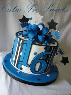 a blue and white birthday cake with stars on the top is for sixteen year old