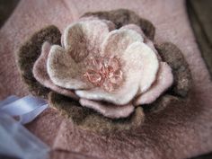 a close up of a flower on a blanket