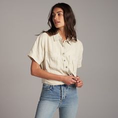 With a boxy silhouette and relaxed fit and made from naturally anti-microbial 100% linen, The Sloane is the perfect easy and breezy summer blouse. Plenty of Rowan details such as herringbone cotton twill tape on the inside front placket for a contrasting reveal when worn with open buttons, our two-hole signature metal buttons, and patch chest pockets. The wide center back box pleat with signature stitch details secured at the top and bottom give movement and flow while holding the Sloane's shape Oversized Plaid Shirts, White Summer Tops, Summer Blouse, Lovely Tops, Twill Shirt, Summer Blouses, Linen Blouse, Chambray Shirt, Box Pleats