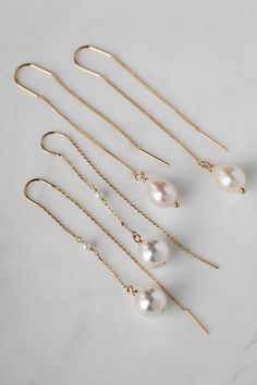 Cecile is a dainty set of pearl drop earrings featuring light-catching Swarovski pearl drops suspended from a fine chain. These delicate details whisper sophistication and style which you will love to wear after your wedding day. * DETAILS * > Designed and handmade in Australia. Worldwide shipping > Swarovski pearls, gold or silver plated settings > Measurement: 65mm * READY TO SHIP * The Cecile earrings are ready to ship. Please allow 5-7 business days for processing plus delivery time Minimalist Long Drop Earrings With Pearl Charm, Minimalist Pearl Linear Earrings For Formal Occasions, Minimalist Pearl Dangle Linear Earrings, Elegant White Drop Threader Earrings, Delicate White Linear Earrings With Pearl Charm, Minimalist Pearl Drop Bridal Earrings, White 14k Gold Filled Long Drop Linear Earrings, Elegant White Dangle Threader Earrings, Minimalist Teardrop Pearl Chain Earrings