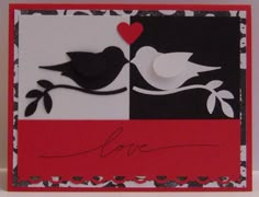 a close up of a greeting card with a bird on the branch and a heart