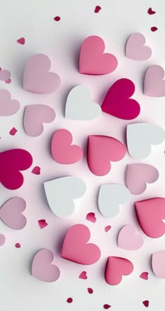 pink and white paper hearts are scattered around