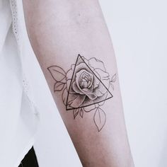 a rose tattoo on the left arm