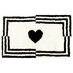 a black and white rug with a heart on it