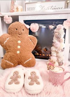 two large teddy bears sitting next to a fireplace with pink fur on the floor and decorations around them