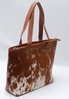 Splendid Lady Hand Bag of Natural Cowhides Absolutely one-of-a-kind, is one of those bags you don't ever want to leave home without. Handcrafted from very finest cowhide, Bag is sumptuous and unique, hand-selected hide and beautiful patterning. And with an abundance of space, it can take whatever you choose to throw at it - your laptop, an extra pair of flats, that stack of post you've been meaning to send. With this stunning cowhide bag on your arm (or slung over your shoulder - you're ready fo Large Brown Bag With Top Carry Handle, Large Brown Shoulder Bag With Top Carry Handle, Brown Satchel For Travel, Brown Double Handle Shoulder Bag Gift, Brown Double Handle Gift Bag, Brown Shopping Gift Bag, Cowhide Bag, Ladies Bag, Corner Protectors