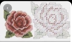 a cross stitch rose next to a piece of fabric