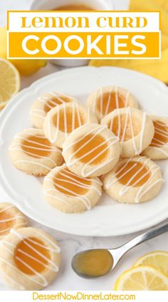 lemon curd cookies on a white plate next to sliced lemons and orange slices