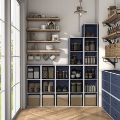 the shelves are filled with various items in this small room, including jars and containers