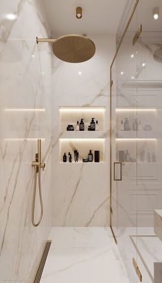 a bathroom with white marble walls and flooring, including a walk - in shower