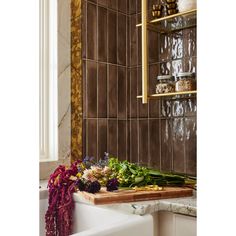 the kitchen counter is covered with flowers and herbs