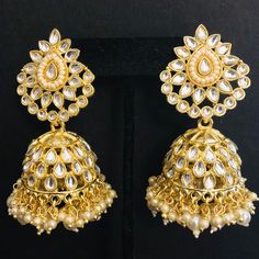 Kundan Pearl Jhumka/ Golden Kundan Jhumka/ Sabyasachi Kundan Earring/ Indian Punjabi Jhumka/ Wedding Earrings/ Bridesmaid Kundan Jhumka Features Traditional Kundan Jhumka Handcrafted To Perfection Light Weight Jewelry Perfect For Indian Weddings And Celebrations A Beautiful & Memorable Gift for Weddings and Special Occasions 22k gold plated jewelry Length: 2.85 Inches Click here to see the complete collection of Kundan and Polki Statement Earrings at AryaFashions: https://www.etsy.com/shop/AryaF Latkans Earrings For Wedding And Navratri, White Cutdana Jhumkas For Wedding, Festive Temple Jewelry Jhumkas For Party, Wedding Chandbalis With Matching Earrings For Navratri, Wedding White Cutdana Jhumkas, Temple Jewelry Style Jhumkas With Latkans For Party, Navratri Bridal Earrings With Meenakari Details, Heavy Earrings For Wedding And Navratri, Bridal Earrings With Latkans For Navratri Wedding