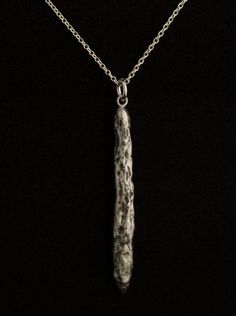 an elegant silver jewelry that represents the Oumuamua. more about Oumuamua on Wikipedia, https://en.wikipedia.org/wiki/%CA%BBOumuamua Oumuamua interstellar object pendant from solid sterling silver hand carved using the lost wax method. Size: 47mm/1.85 inch high. comes on a 18 inch/ 45 cm long sterling silver chain.If you would like a 20 inch / 50 cm long chain please leave me a note in the message to seller form when checking out. If you choose the 14k goldplated option, it comes with an 18 in White Gold Sterling Silver Rectangular Pendant, Minimalist Long Drop Jewelry For Gift, Silver Hand Cast Round Pendant Necklace, Modern Hand Cast Jewelry As Gift, Sterling Silver Rectangular Pendant With Polished Finish, White Gold Jewelry With Large Rectangular Pendant, White Gold Amulet Jewelry With Large Pendant, Oxidized Silver Long Drop Jewelry, Fusion Style Sterling Silver Necklaces In Silver