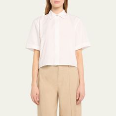 Vince crop shirt punctuated by mother-of-pearl buttons Approx. 22.1”L from shoulder to hem Spread collar; hidden button placket Short sleeves Yoked back Hip length Boxy fit Cotton Imported Classic Cropped Shirt For Office, Classic Cropped Shirt For Daywear, Classic Cropped Shirt, Classic Cropped Shirt For Office In Spring, Classic Spring Cropped Shirt For Office, Elegant Cropped Cotton Shirt, Classic Cropped Shirt With Button Cuffs, Classic Spring Cropped Shirt With Button Cuffs, Classic Collared Cropped Shirt For Office