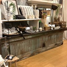 a room filled with lots of different types of furniture and decor on top of wooden shelves