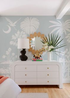 Our Charleston Marsh Mural, in collaboration with Megan Molten, captures the serene beauty of the South Carolina coast, featuring delicate motifs of palm trees, coastal flowers, and graceful birds. Rendered in a palette of muted colors—soft blues, gentle greens, and sandy beiges—it evokes the tranquil atmosphere of seaside living. The intricate patterns flow seamlessly, creating a sense of depth and movement. Ideal for adding a touch of elegance and coastal charm to any space, this wallpaper inv Charleston Marsh, Woodsy House, Coastal Flowers, Megan Molten, Dining Room Bar Cart, South Carolina Coast, Hanging Installation, Loose Linen Pants, Cape Dutch