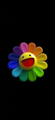 a colorful flower with a smiley face on it's back ground and black background