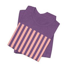 Introducing our Coral Pink Stripes Shirt, a feminine and chic addition to your wardrobe. Made with pretty pink and white vertical stripes, this classic t-shirt brings a cute and stylish touch to any casual outfit. This classic unisex jersey short sleeve tee fits like a well-loved favorite. These soft cotton t-shirts have-ribbed knit collars to bolster shaping. The shoulders are tapered for a better fit over time. Dual side seams hold the garment's shape for longer. .: Made with 100% Airlume comb Pink Ribbed Cotton T-shirt, Pink Cotton Beach T-shirt, Pink Relaxed Fit T-shirt For Sports, Unisex Pink Playful T-shirt, Playful Pink Relaxed Fit T-shirt, Pink Tshirt, Vertical Stripes, Pink Stripes, Coral Pink