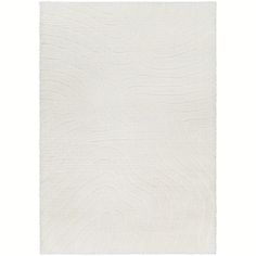 a white rug with wavy lines on it