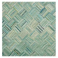 an area rug with green and blue colors