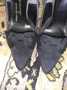 These are the most darling shoes I've seen in awhile. 1960s Jacqueline black silk pumps with perfect bow at opening! 3.5 inch spiked/stiletto heel offers a little sass to the elegance of these shoes. Size 6.5B they will arrive in their original box. Retro Court Shoes With 4-inch Heel For Party, High Heel Cocktail Heels With Satin Bow, Classic Evening Heels With Bow, Round Toe Heels With Satin Bow For Evening, Evening Heels With Satin Bow And Round Toe, Classic Formal Heels With Bow, Formal Closed Toe Heels With Satin Bow, Fitted Closed Toe Heels With Satin Bow, Fitted Satin Bow Heels With Closed Toe