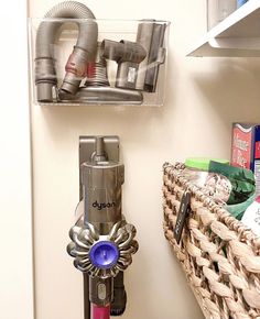 there are many different items on the shelf in this bathroom that is organized with baskets