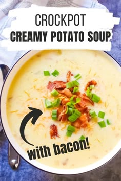 a bowl of creamy potato soup with bacon and green onions in it, on top of a blue table cloth