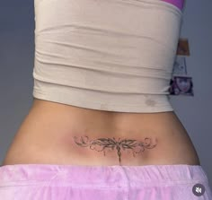 a woman with a tattoo on her stomach