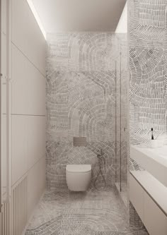 a white toilet sitting next to a sink in a bathroom under a skylight,