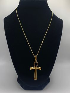 Ankh Necklace, Gold Ankh Necklace, Silver Ankh Necklace, Egyptian Necklace, Gold Necklace, Silver Necklace Elevate your style and spirituality with our Ankh Necklace. This timeless accessory is the perfect addition to any outfit.  Add a touch of sophistication with this beautiful, classic accessory that evokes positive energy and serves as a powerful symbol of life and eternity. Make a statement with this beautiful piece! Chain:     18K Gold Plated                  17.5 inch chain with 2 inch extender                  Lobster Claw Clasp Gold Pendant: 44.5mm long, 25.5mm wide Silver Pendant: 44.5mm long, 27mm wide Luxury Spiritual Long Necklace, Ancient Egypt Necklace, Shifting Realities Symbol Necklace, Gold Spiritual Necklace, Cheap Spiritual Chain Necklace, Egyptian Ankh Necklace, Cheap Spiritual Ankh Jewelry, Luxury Symbolic Ankh Necklaces, Cheap Ankh Spiritual Jewelry