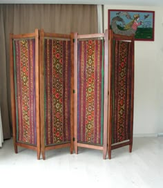 This gorgeous colorful bohemian upholstered wooden room divider would look great anywhere in your living room, office or bedroom. It is entirely made of solid cherry wood and is made in the 1920s or 1930s. PLEASE CONTACT US WITH YOUR LOCATION FOR AN EXACT SHIPPING QUOTE! It has been entirely sanded, stained and oiled. The original fabric was beyond redemption so we replaced it with vintage kilim. Making it a bold, rich, and statement piece of furniture. It would look great in the middle of a roo Room Divider Inspiration, 1920s Room, Office In Home, Fabric Room Divider, Vintage Room Divider, Divider Shelves, Room Divider Shelves, Hippie House, Fabric Room Dividers