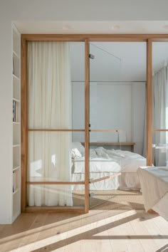 a bedroom with sliding glass doors leading to a bed