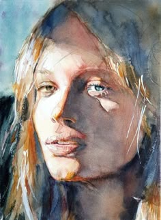 a watercolor painting of a woman's face with long hair and blue eyes