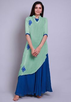 Faux Georgette Layered Kurta in Sea Green and Teal Blue. This Readymade attire with Shantoon Lining is Enhanced with Resham Work and is Crafted in Chinese Collar Neck and Elbow Sleeve. Available with a Lycra Leggings in Teal Blue. For Sizes 46 to 66, a matching shantoon churidar will be available having length 50 inches. Do note: Accessories shown in the image are for presentation purposes only and length may vary upto 2 inches.(Slight variation in actual color vs. image is possible).  We sell a Green Straight Kurta Dress With Embroidered Neckline, Green Straight Kurta With Embroidered Neckline, Green Embroidered Neckline Straight Kurta Dress, Green Sets With Embroidered Neckline, Traditional Blue Kurta With Embroidered Neckline, Blue Traditional Kurta With Embroidered Neckline, Blue V-neck Sets With Resham Embroidery, Blue Kurta With Embroidered Neckline For Spring, Blue Floral Embroidery Straight Kurta Dress